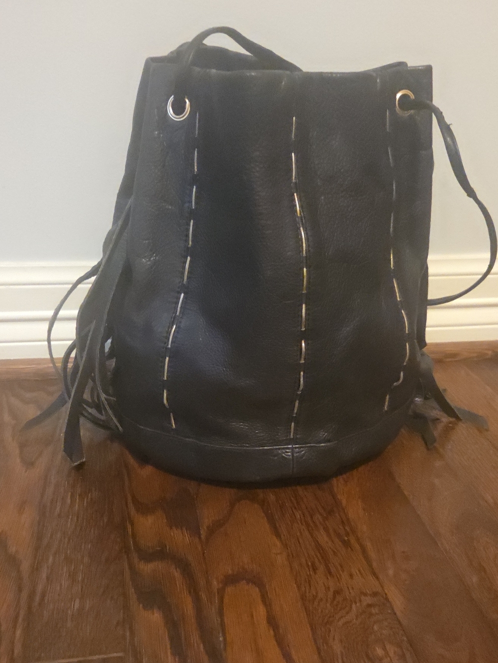 Kelsi Dagger Black Leather Drawstring Bucket Bag with Fringe
